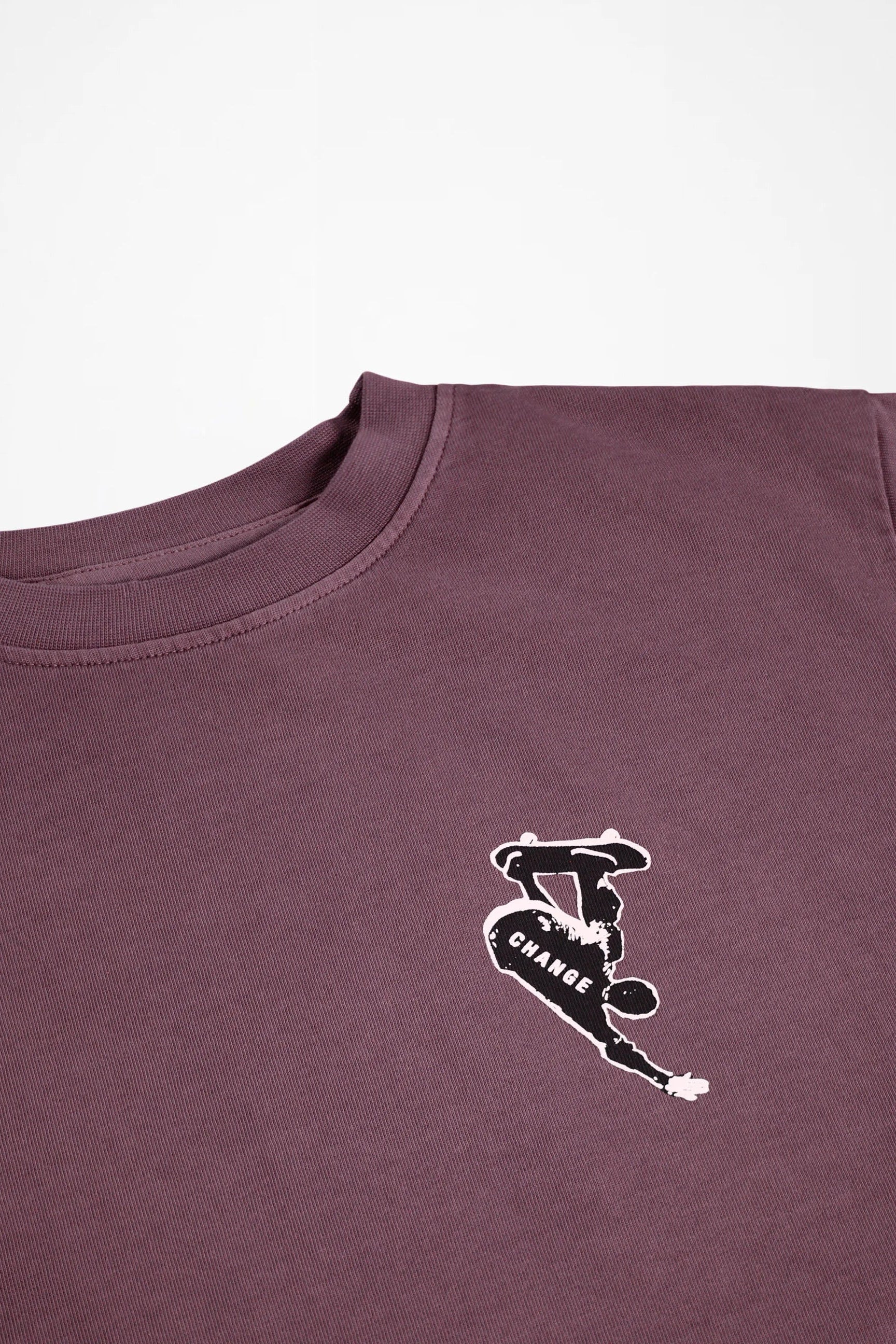 Kids long-sleeve crewneck shirt close-up of small chest logo graphic in dark purple