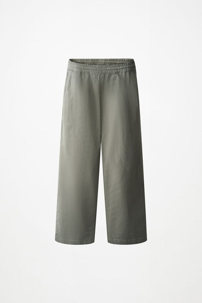A pair of wide-leg cropped pants in a muted sage green color, shown flat against a plain white background.