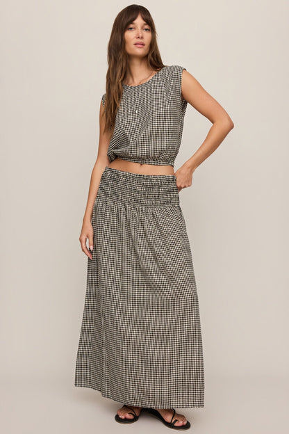 Front view of woman wearing Merit Gingham top in black & white with matching skirt 