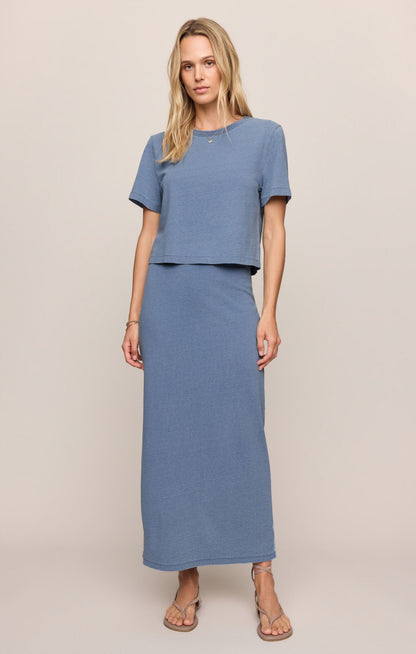 Indigo blue jersey denim midi skirt with straight hem and side seam detail.