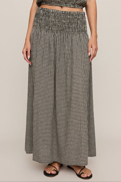 Front view of woman wearing brooke gingham skirt in black & white 