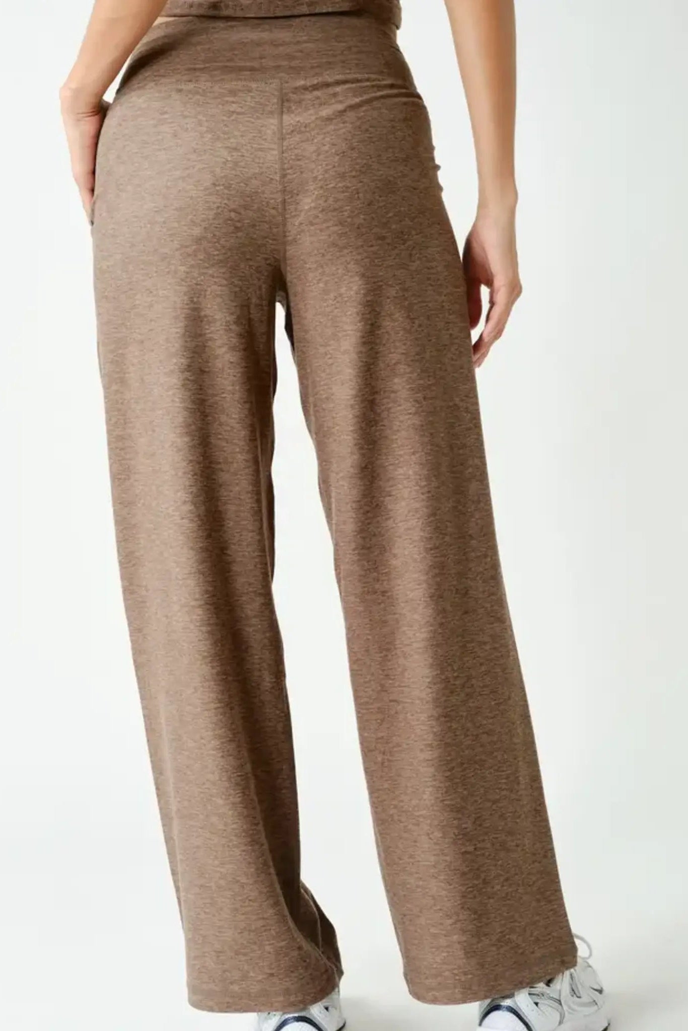 Back view of active pants in truffle with elastic waistband and tapered back seam