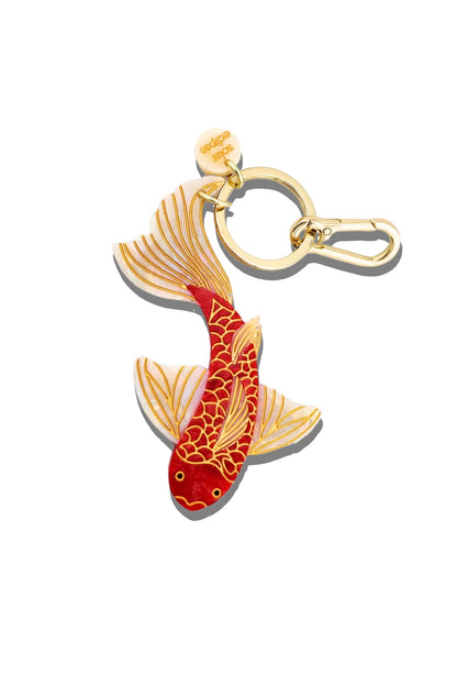 Keychain with a red and gold koi fish design on a white background