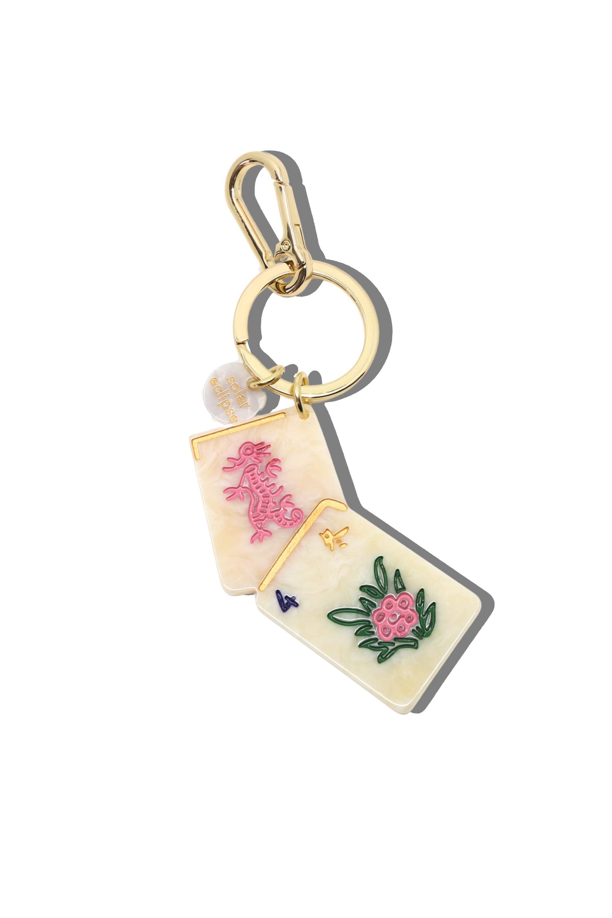 Mahjong Keychain with pink and green designs 