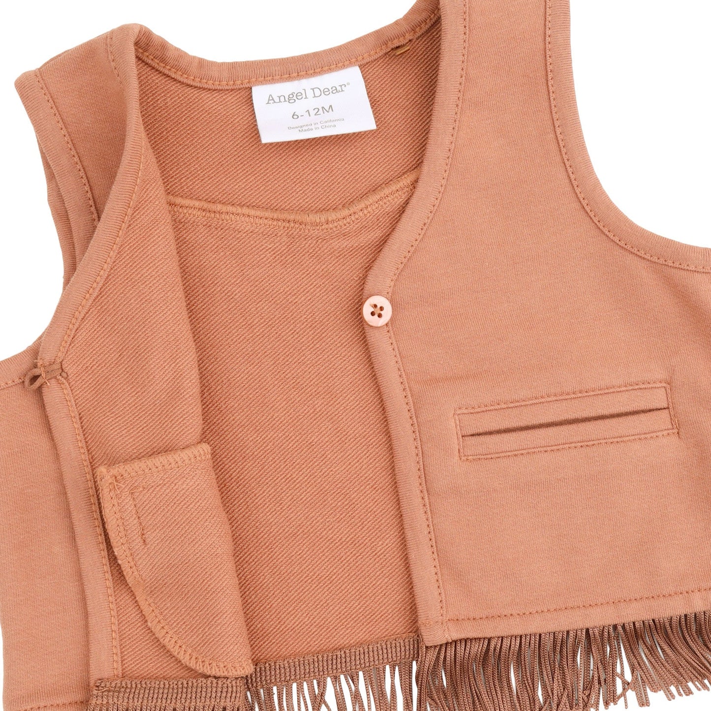 A close-up of a toddler's sleeveless vest in a solid mocha mousse color, featuring a single button closure, a chest pocket, and fringe trim along the hem. The brand label reads 'Angel Deas'.
