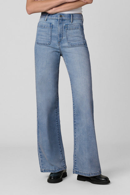 Front view of a woman wearing Joe's Mia Patch Pocket blue jeans in Amiable color on a white background 