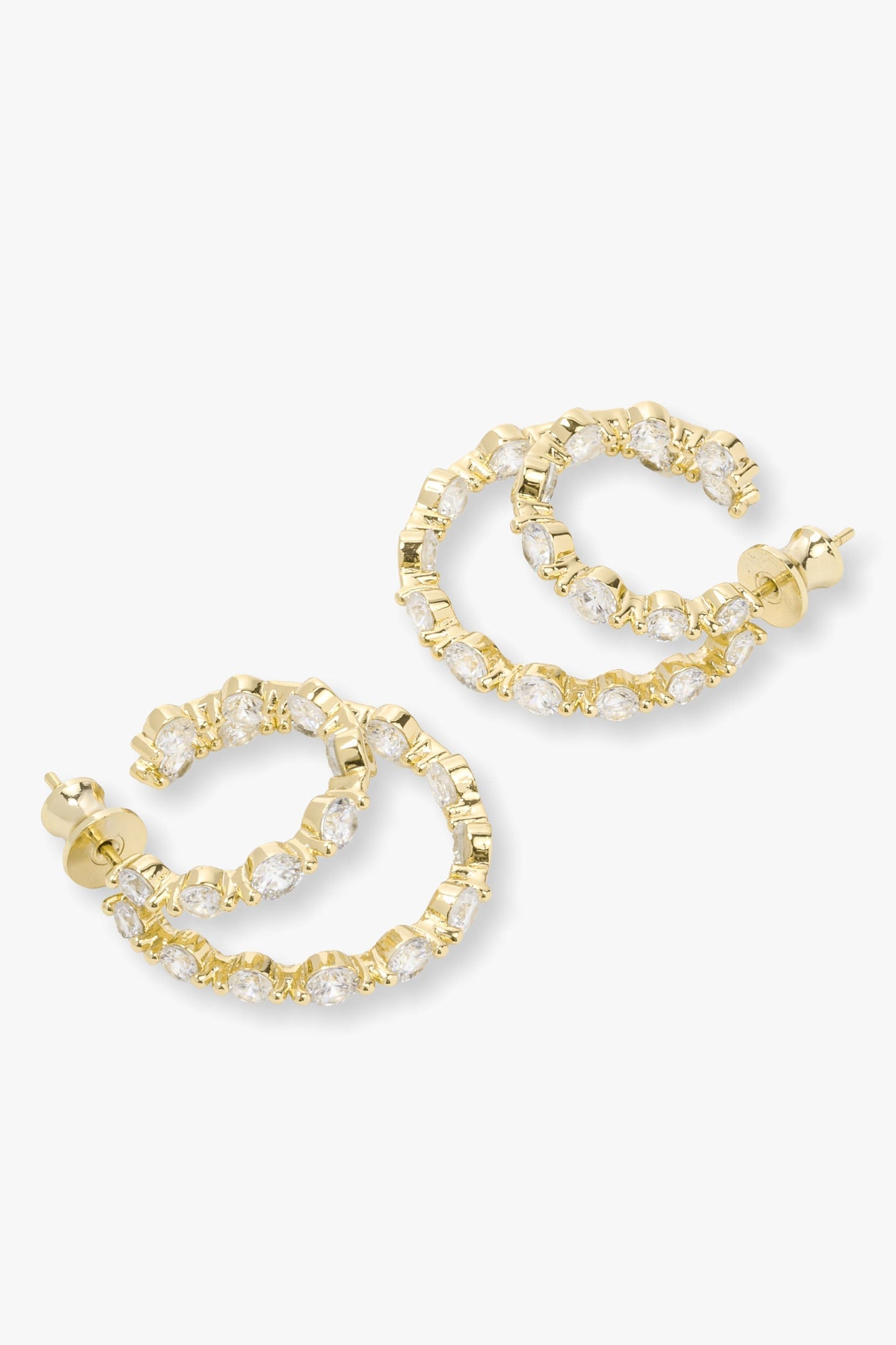 Gold icon double hoop earrings with pearl-like stones on a white background