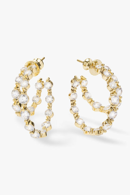 Gold double hoop earrings adorned with clear faceted rhinestones &pearls , displayed on a clean white background.