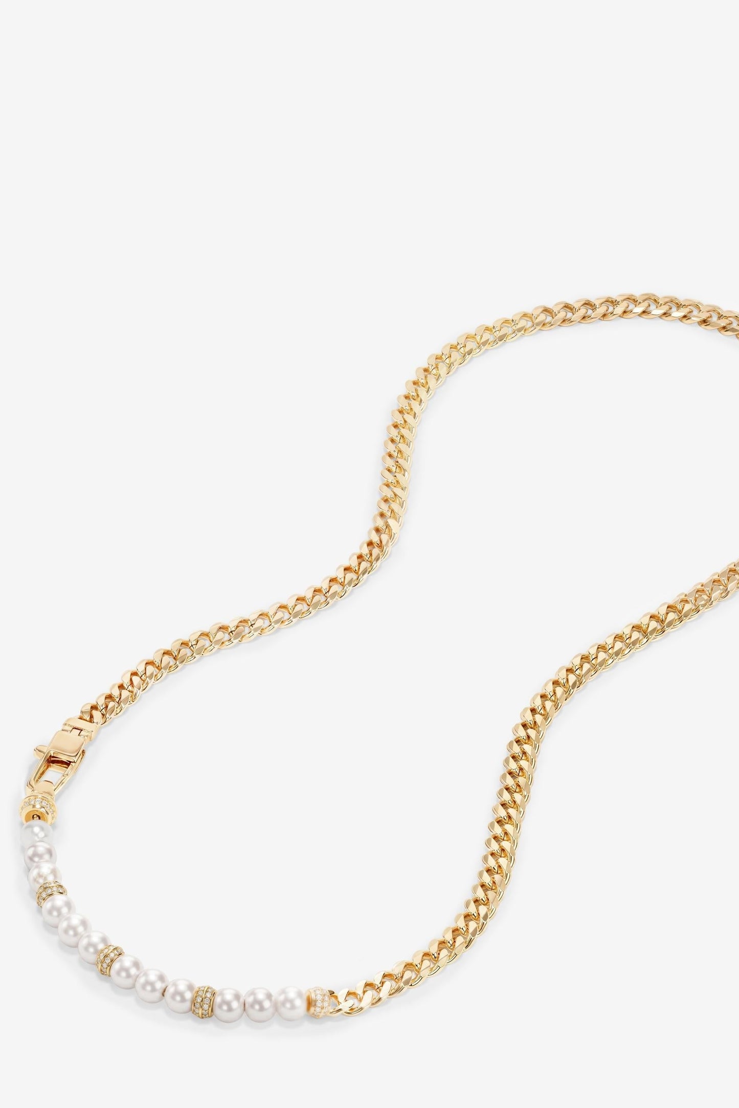 Gold chain necklace with white pearls on a white background