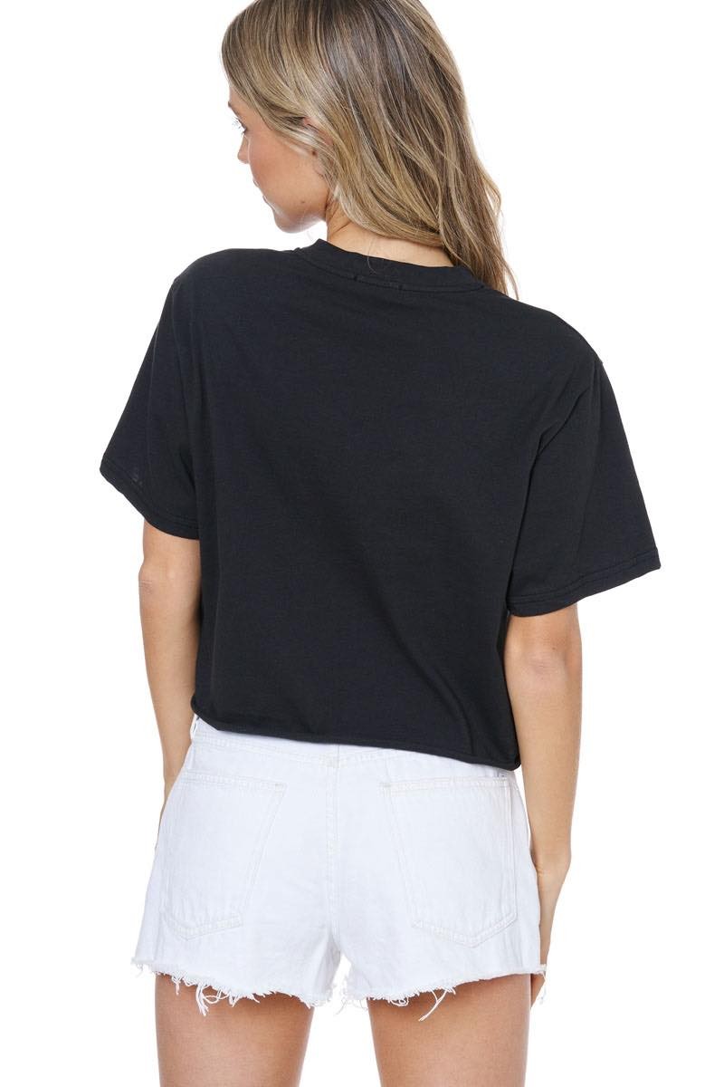 Person wearing a black t-shirt and white shorts on a white background
