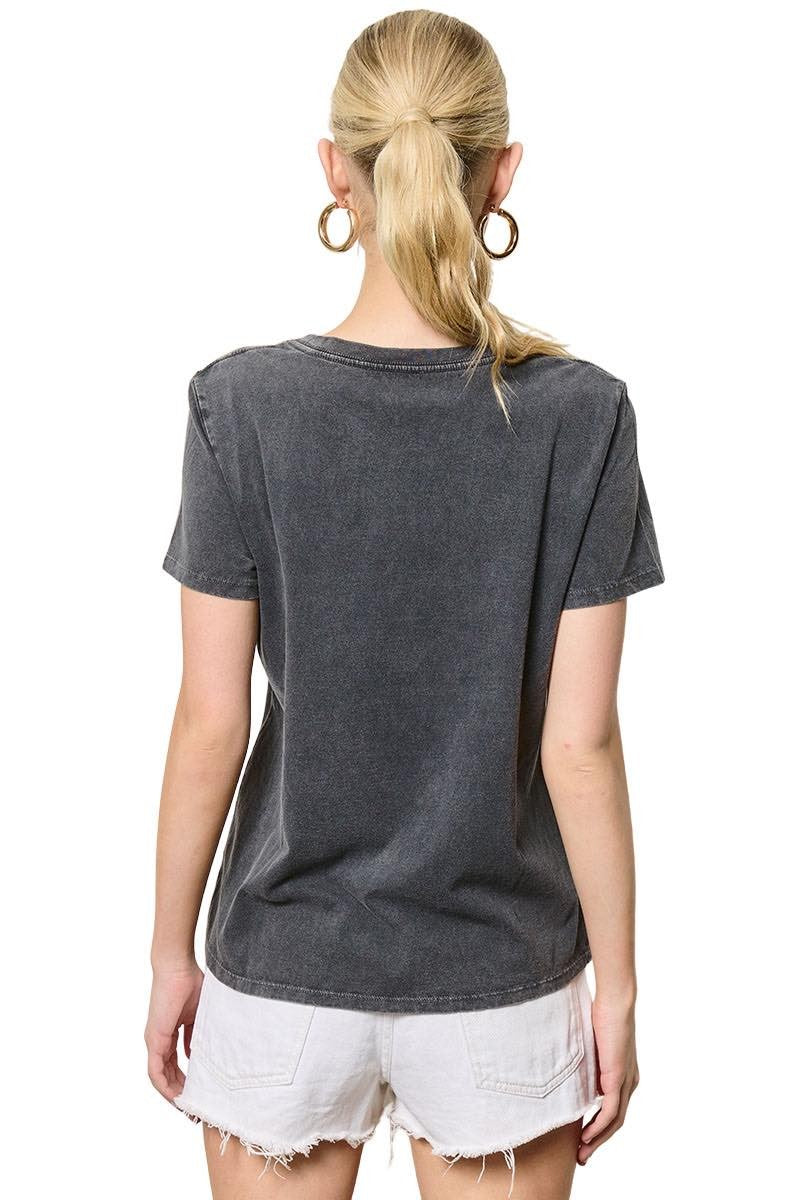 Person wearing a dark gray t-shirt and white shorts on a white background