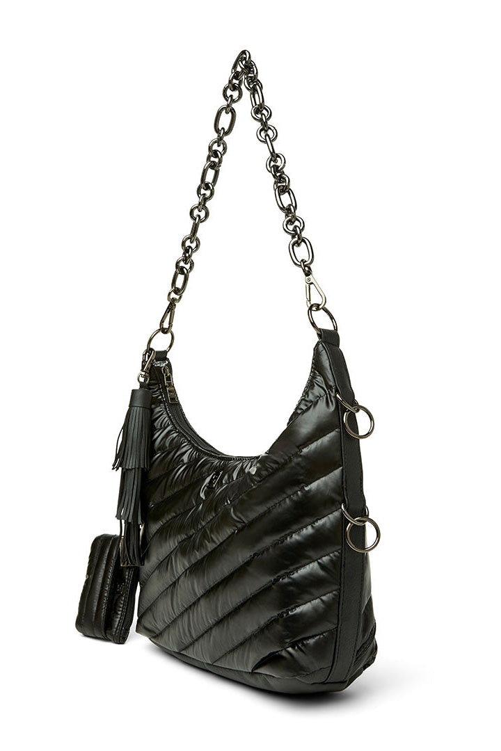 A black quilted ICON hobo shoulder bag with a silver-tone chain strap and matching tassel detail, shown on a plain white background.