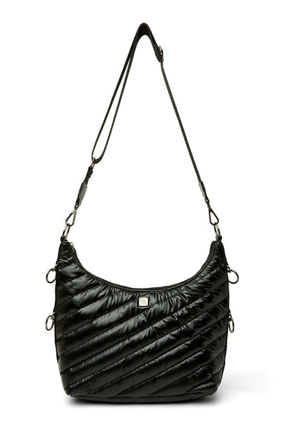 An ICON black quilted crescent-shaped shoulder bag with diagonal stitching, a thin black shoulder strap, and silver-tone hardware, shown against a plain white background.