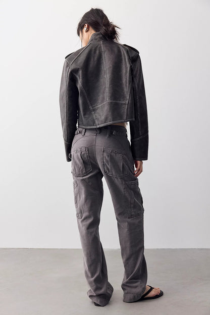 Woman shown from the back wearing a washed black jacket and Tight fuse slim utility pant in charcoal grey 