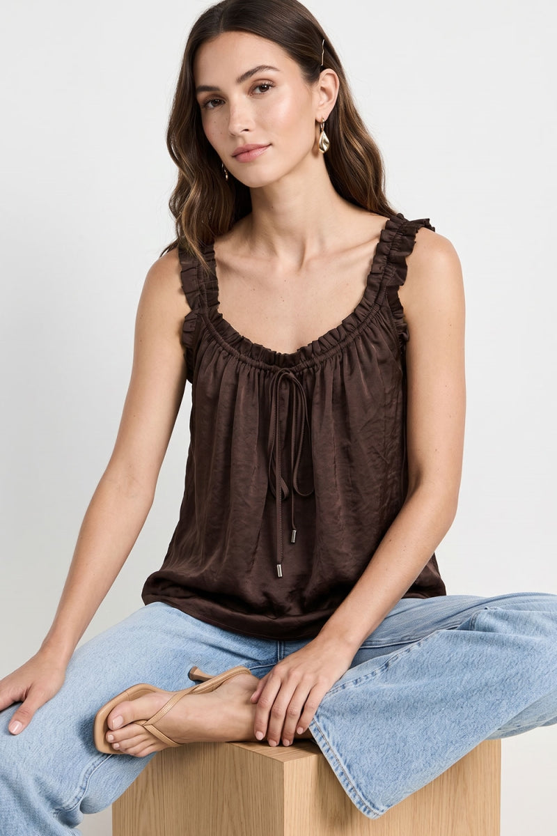 Woman wearing a satin Ruffle Trim Tie Neck Tank in chocolate brown color 
