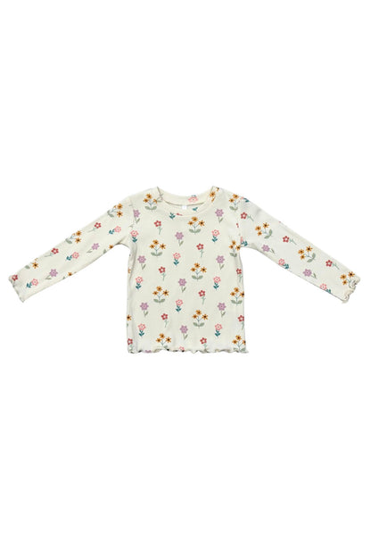 A long-sleeve baby/toddler knit top in cream with an all-over small meadow bloom floral print in pink, orange, yellow, and green, laid flat on a white background.