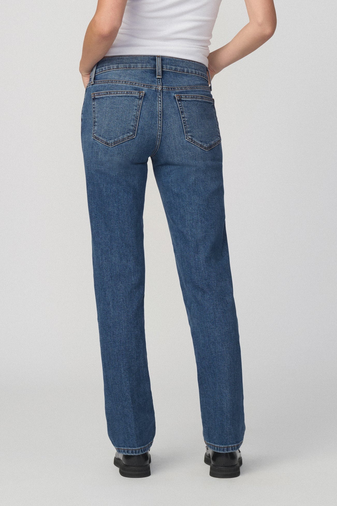 Back view of woman wearing Amalfi colored Romy straight leg jeans