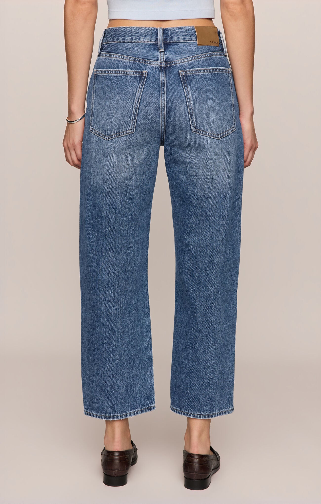Back view of person wearing Off Duty Bowed Ankle Jeans in Breakpoint color variant