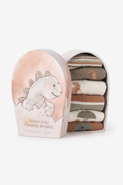 Elegant Baby dinosaur socks in a decorative arched gift box, with the box open to reveal a stack of folded socks in soft earthy colors.