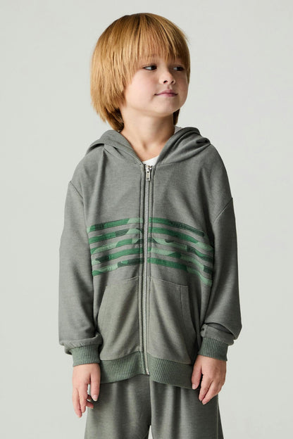Boy wearing a safari cool camo print stripe hoodie with matching pants 