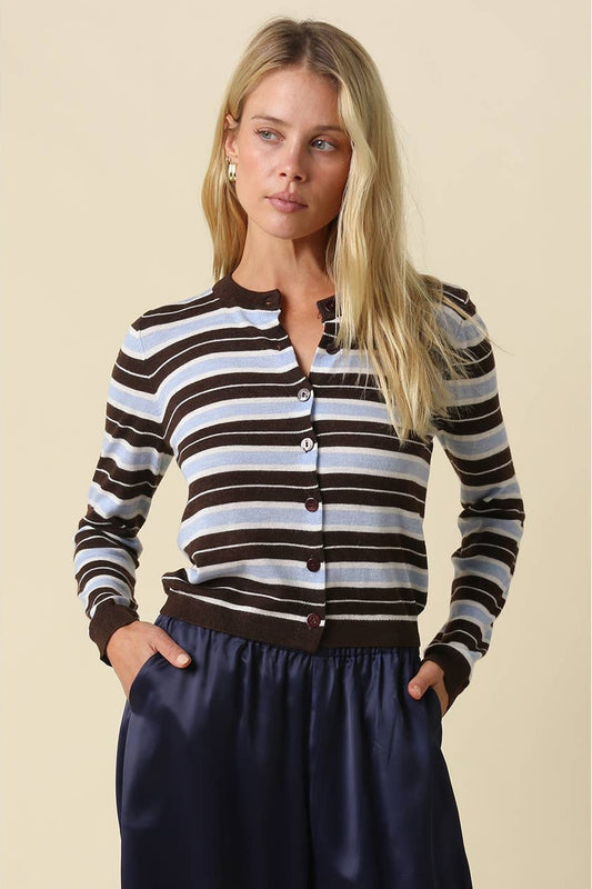 Striped cardigan sweater in Coffee, Light blue, and white horizontal stripes with navy pants.