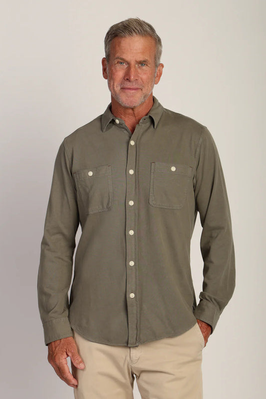 Man wearing long sleeve button down shirt with double pockets in agave color 