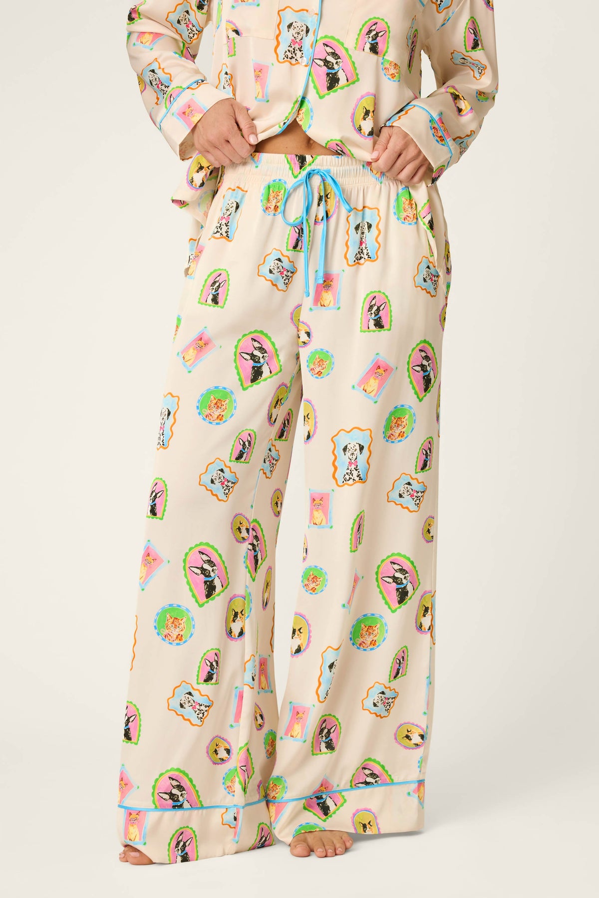 Woman wearing picture purfect silk pajama pants with matching long sleeve top 