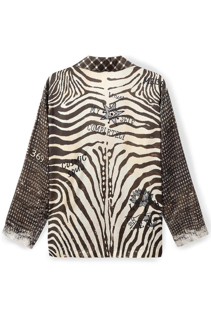 A long-sleeve Audrey Collar jacket featuring a Noir Muse zebra print pattern on the back and a textured, dotted brown pattern on the sleeves, with graphic text and illustration prints on a white background