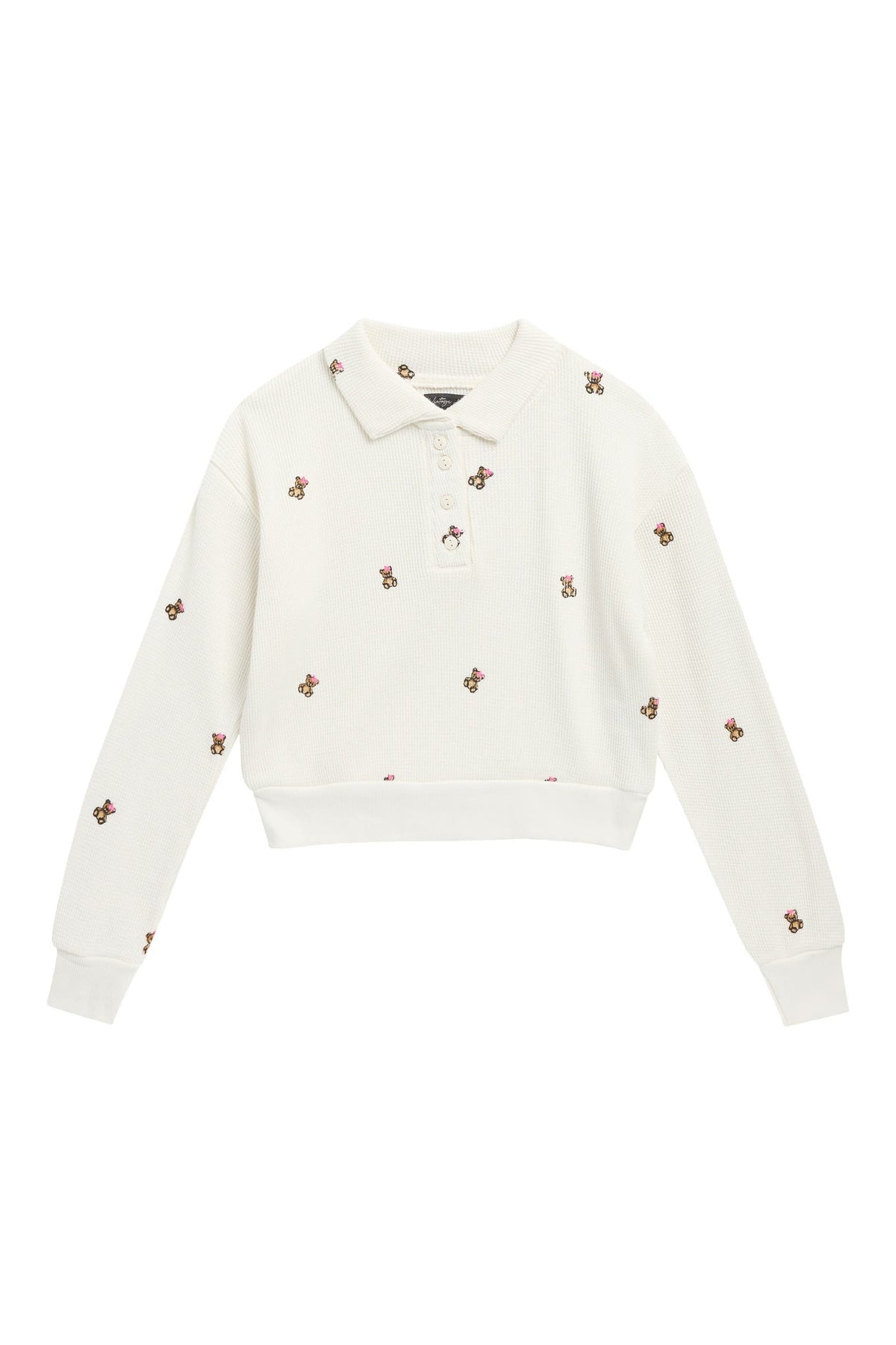 An off-white long-sleeve cropped polo sweatshirt with small embroidered bears scattered across the front, displayed on a solid white background.