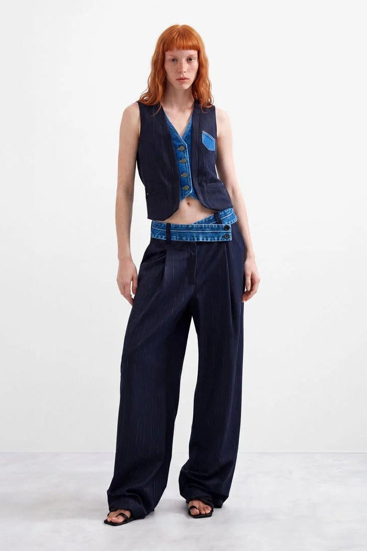 Woman wearing Azul Oscuro Double Lapel Vest with matching navy pants 