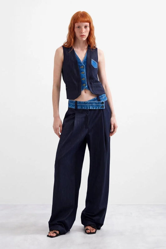 Woman wearing Azul Oscuro Double Lapel Vest with matching navy pants 