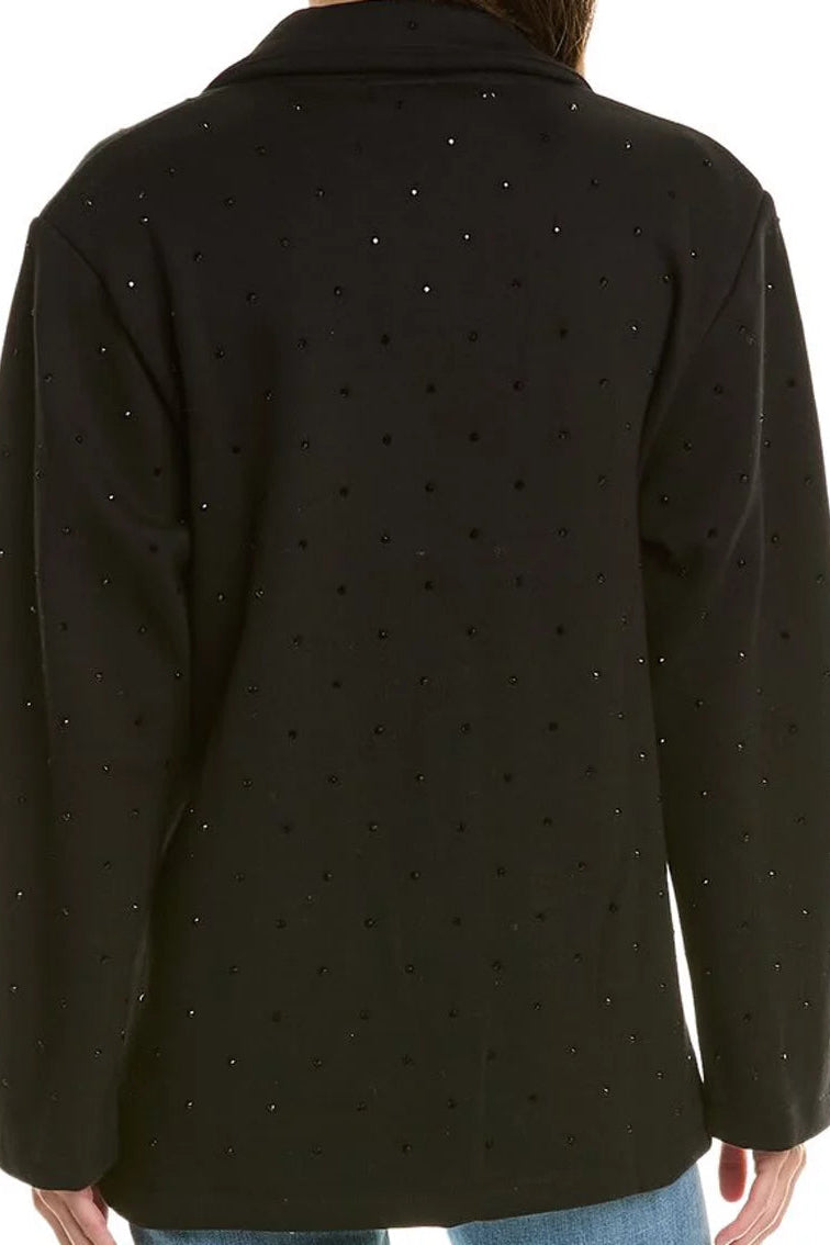 A person shown from the back wearing a black long-sleeve jacket or blazer with a subtle rhinestone pattern, paired with blue jeans against a plain white background.