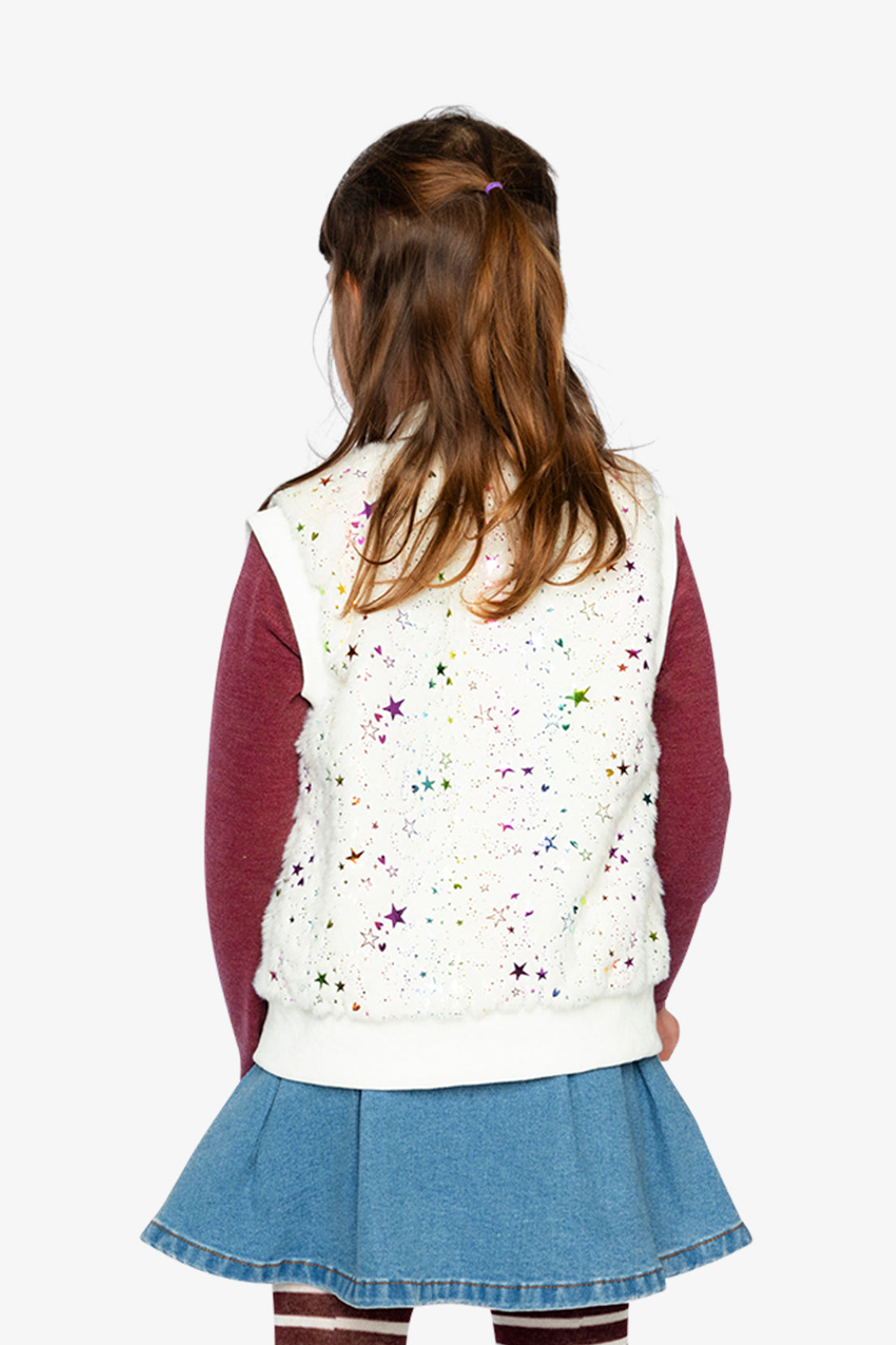 Child wearing a white vest with colorful star patterns, maroon long-sleeve shirt, and blue skirt on a white background.