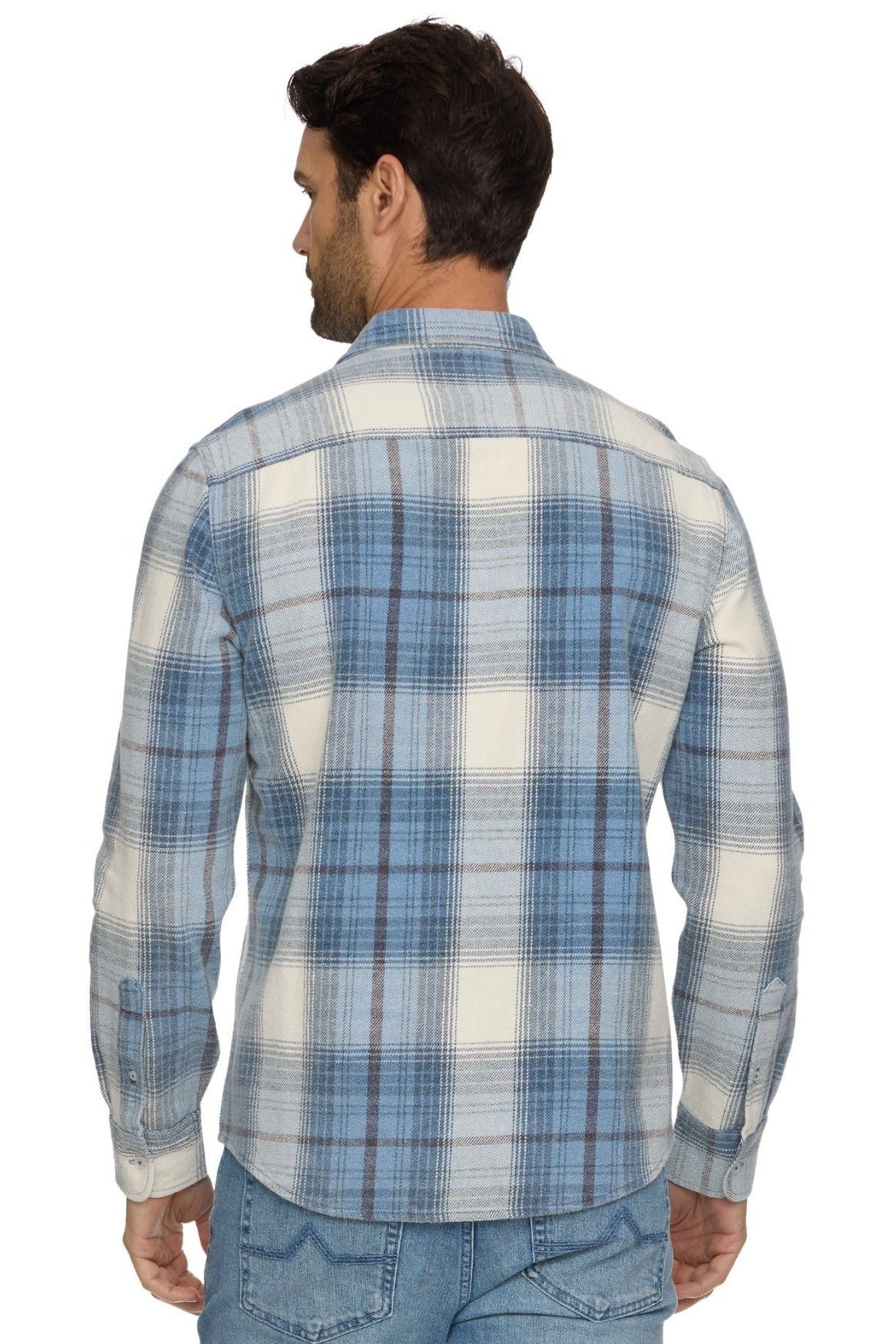 A man viewed from the back wearing a long-sleeve Asheville Vintage Wash plaid button-up shirt in light blue and off-white, paired with blue jeans, against a plain white background.