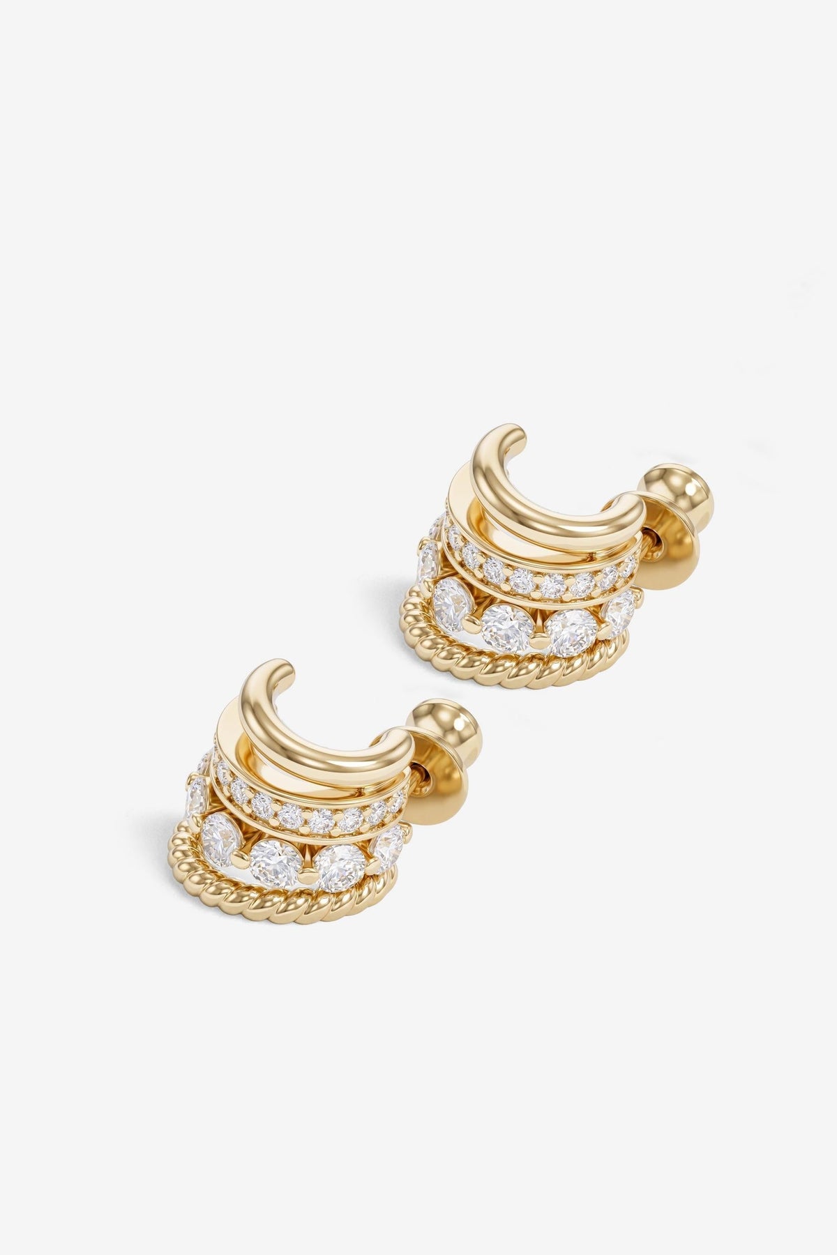 A pair of gold crescent-shaped Ashley Venice hoop earrings adorned with multiple rows of clear pavé-set gemstones, shown on a clean white background.