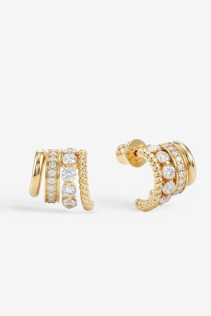 A pair of gold Ashley Venice huggie hoop earrings adorned with multiple rows of clear pavé-set round gemstones, shown on a clean white background.
