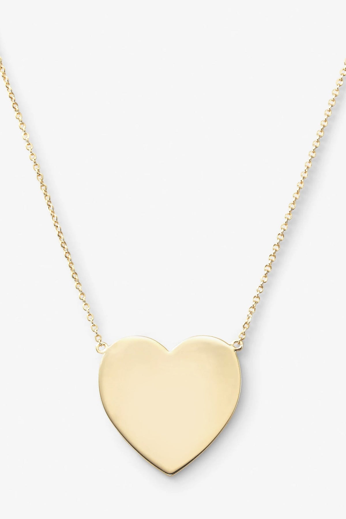 Gold have my heart-shaped pendant on a chain against a white background