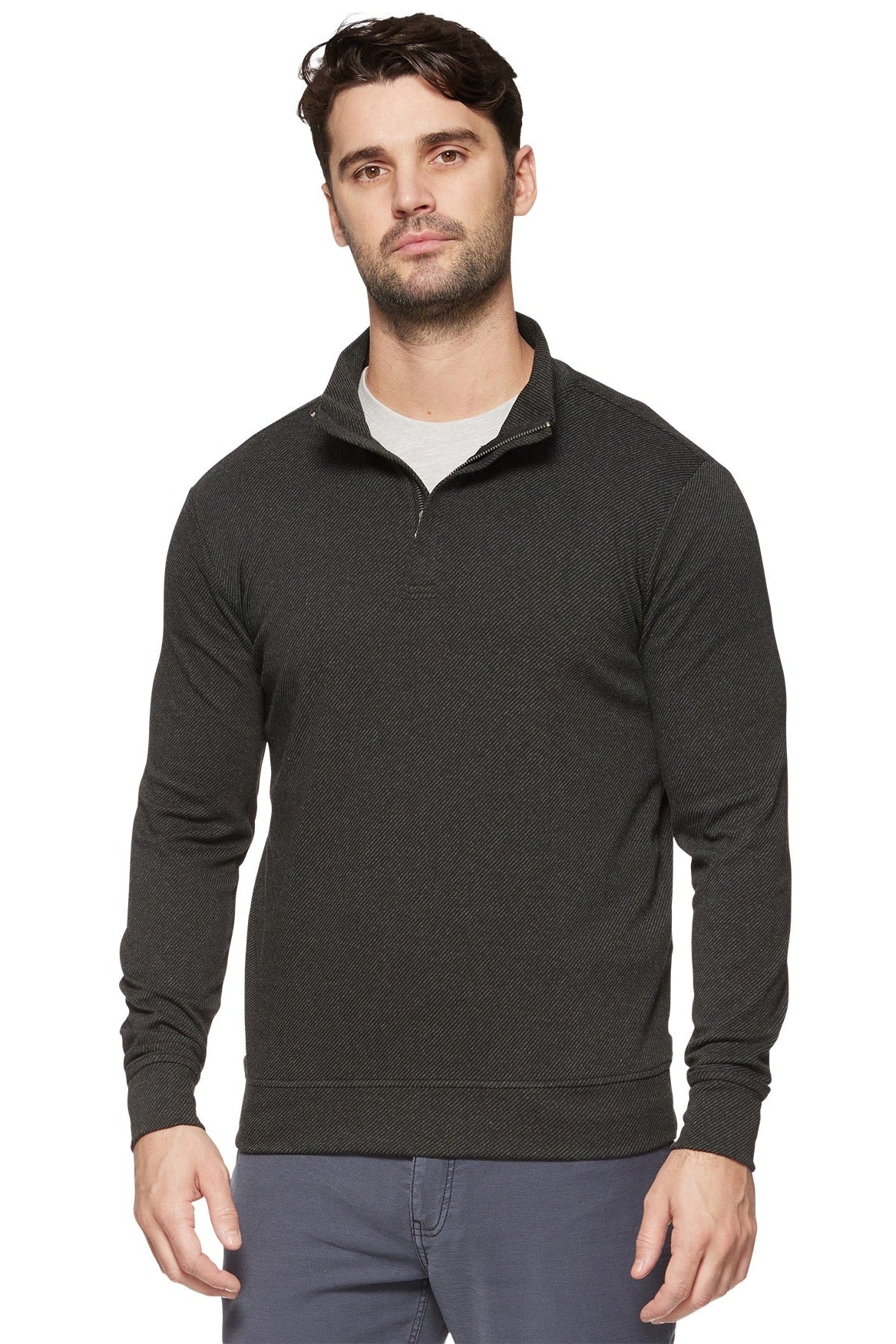 Man wearing a Hero Twill 1/4 zip mock neck top in charcoal gray
