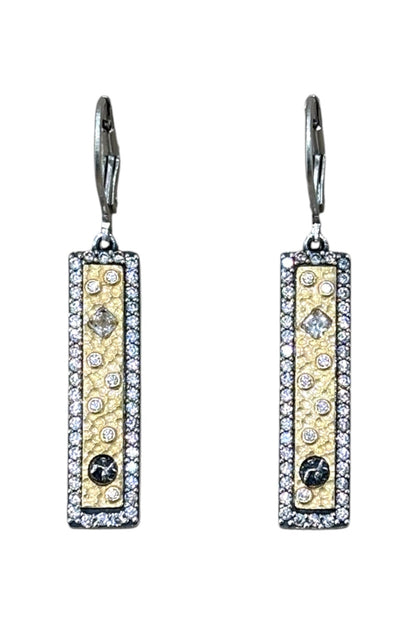 Pair of silver & gold rectangle pendant diamond earrings on a white background