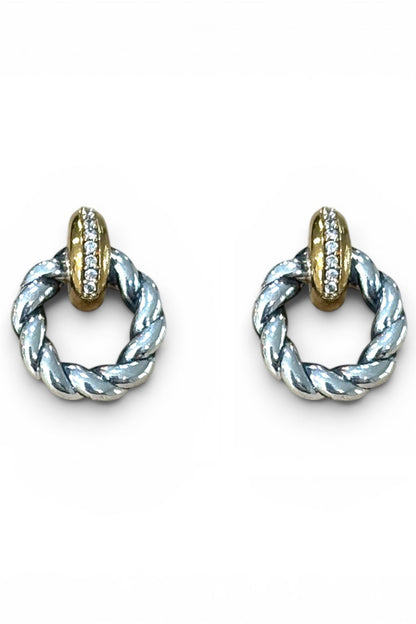 A pair of 2tone veda twist silver and gold hoop earrings with a twisted rope design and a small row of clear stones on the gold top, shown on a plain white background.