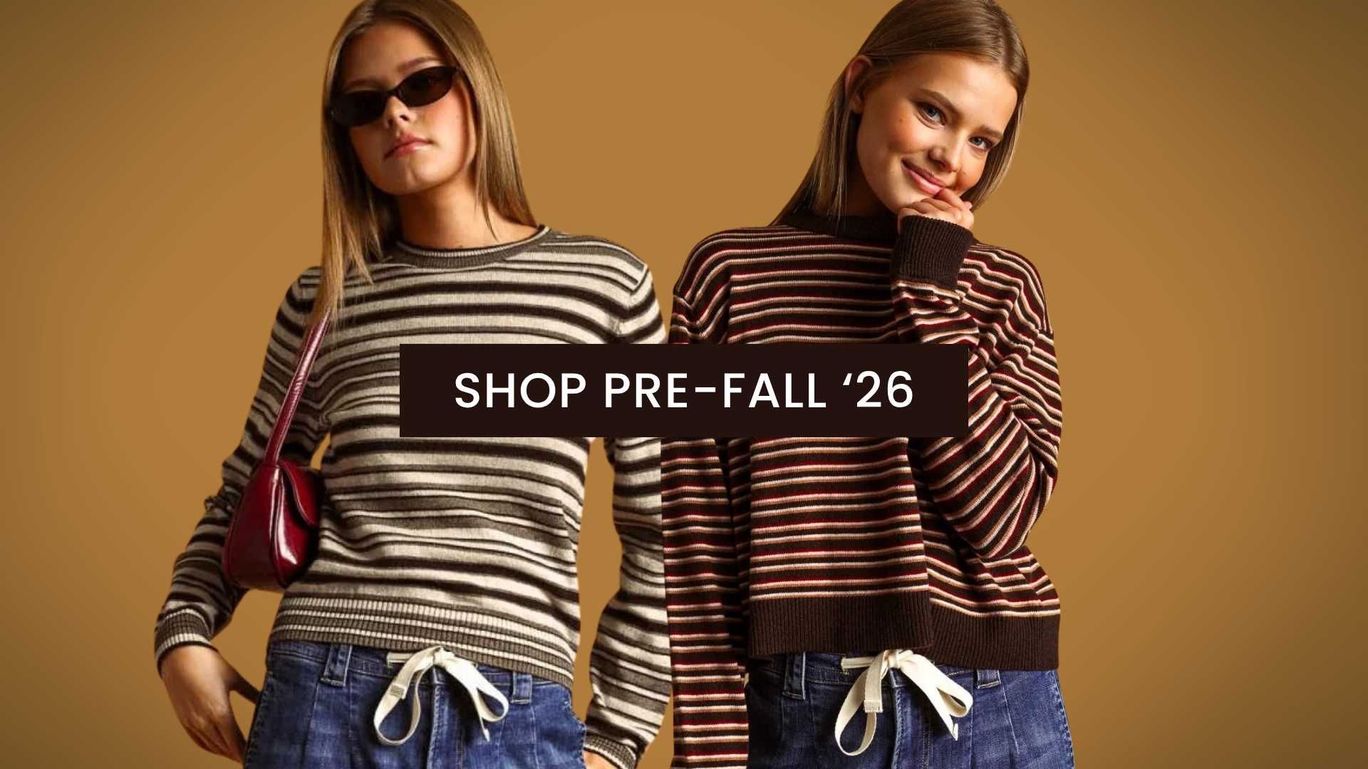 Two women modeling striped knit sweaters against a warm tan background, with a central text banner reading 'SHOP PRE-FALL '26'. The left model wears a cream and dark gray striped sweater with blue jeans and a burgundy shoulder bag; the right model wears a dark red and brown striped sweater with blue jeans and white drawstrings.