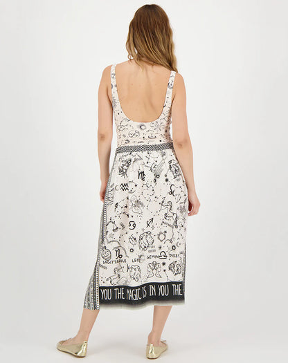 beige midi skirt with black border and zodiac print on model back view