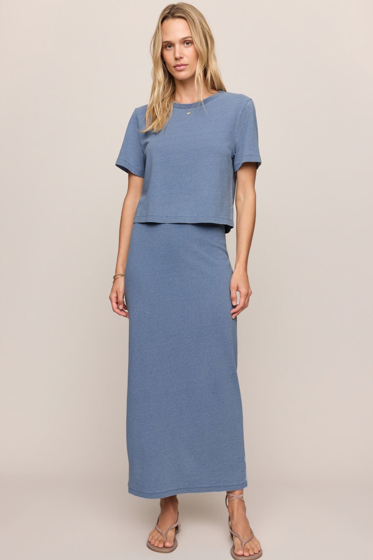 Jersey denim midi skirt in indigo blue with elastic waist and straight silhouette.