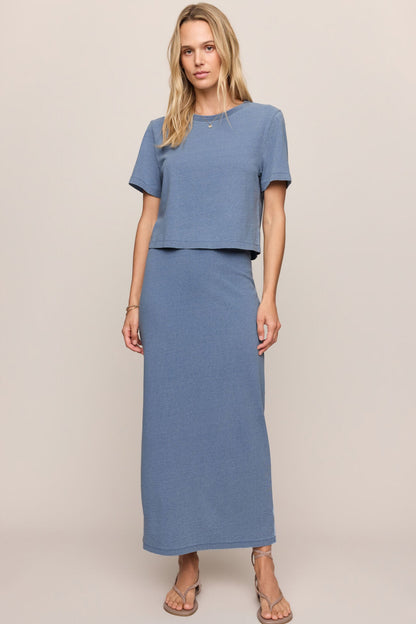Jersey denim midi skirt in indigo blue with elastic waist and straight silhouette.