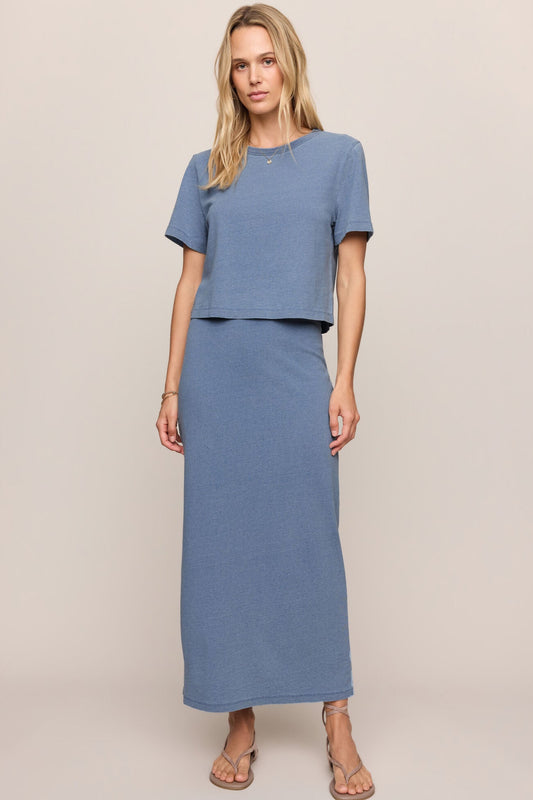 Jersey denim midi skirt in indigo blue with elastic waist and straight silhouette.