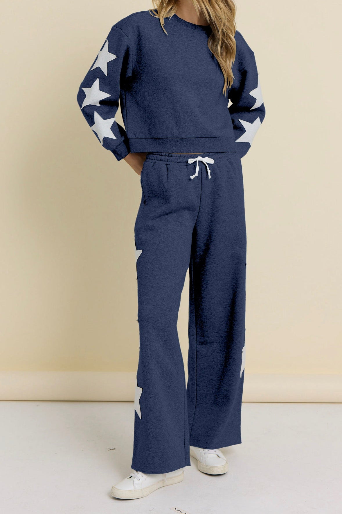 Navy terry wide-leg pants with drawstring waist and star prints