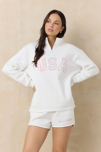 White fleece quarter-zip sweatshirt with red USA logo