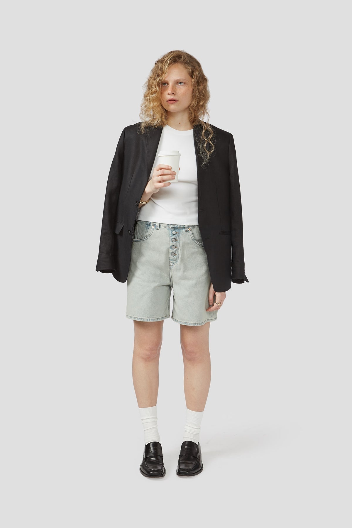 Light-wash denim shorts with belt loops, button fly, and front pockets