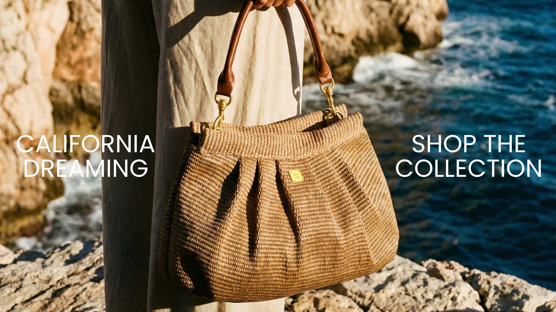 Person holding a woven handbag by a coastal area with text 'California Dreaming' and 'Shop the Collection'.