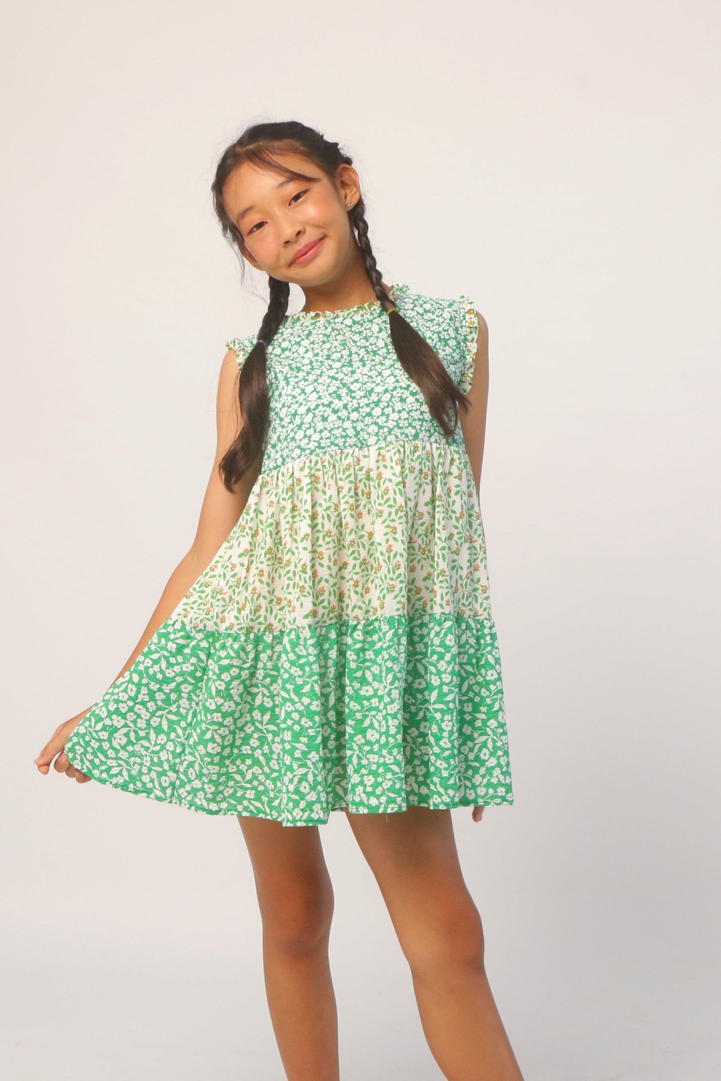 Green ditsy floral sleeveless dress with tiered skirt and ruffled top